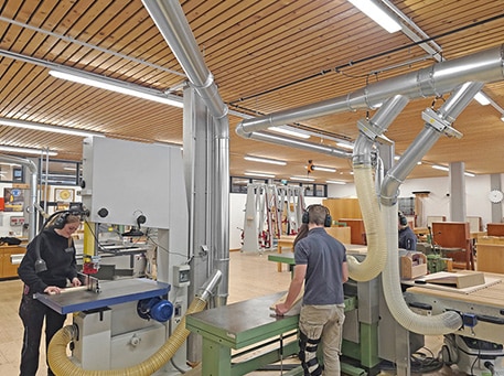 woodworking Workshop environment with multiple machines in use